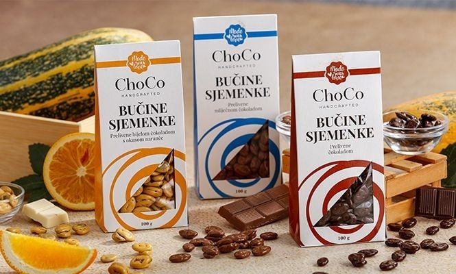 Bučine sjemenke prelivene bijelom čokoladom s okusom naranče 100 g